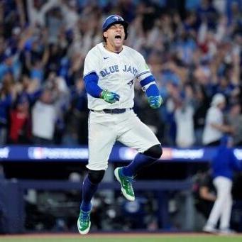 George Springer celebrates the three-run home run that fired the Toronto Blue Jays into the World Series